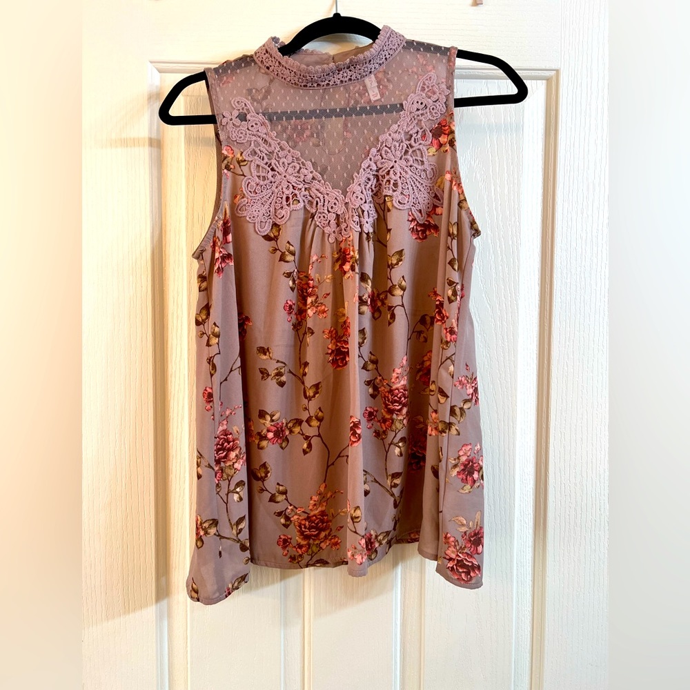 Xhilaration Woman’s Mock Neck Floral Top with Lace design in front.